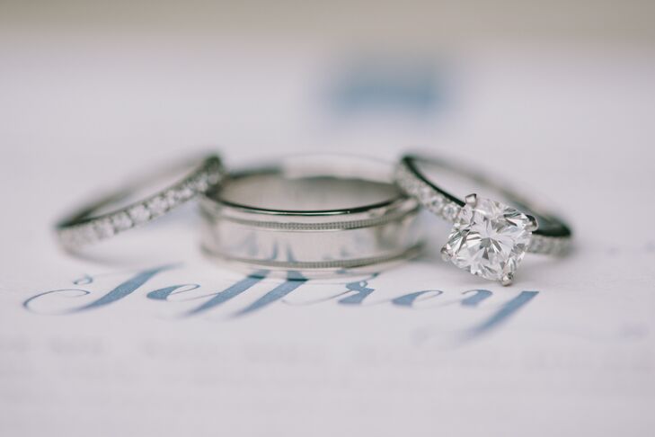 "Jeff and I love simple and classic designs, and wanted to choose rings that reflected that," Jauchy says. "My husband fancies himself a raccoon because of how much he loves things that sparkle, so he had spent considerable time (unbeknownst to me) at Tiffany & Co. inspecting diamonds under a microscope. He ended up selecting the Tiffany Novo, which features a cushion­-cut diamond, and we opted for the matching wedding band. For Jeff, we decided on a double milgrain wedding band whose shape complemented my rings."