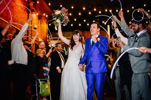 Modern Glow Stick Exit with Couple in Classic Gown and Bright Blue Suit