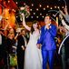 Modern Glow Stick Exit with Couple in Classic Gown and Bright Blue Suit