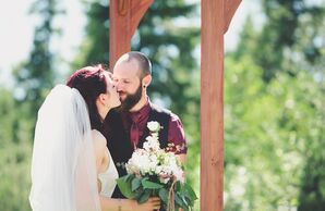 Groom in Burgundy and Black During Mountaintop Ceremony