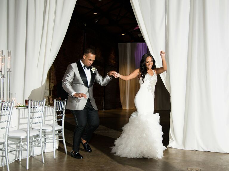 Bride and groom dancing into their reception. 