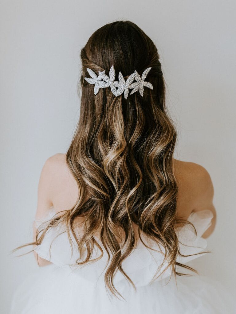 Model wears star shaped clips in her hair. 