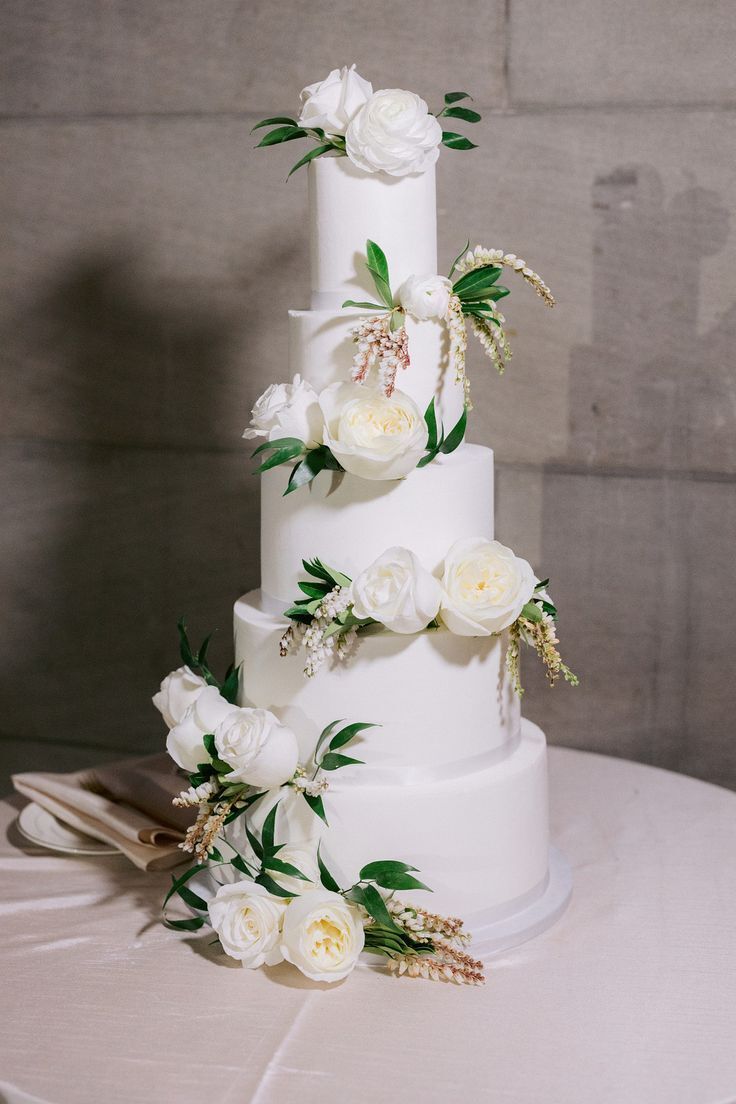 five-tier wedding cake with white flowers