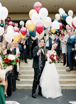 Bride and Groom with Balloons in Front of Wedding Guests