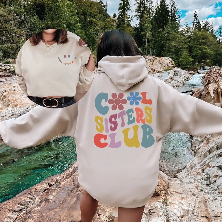 Oversized graphic sweatshirt featuring retro lettering that reads 