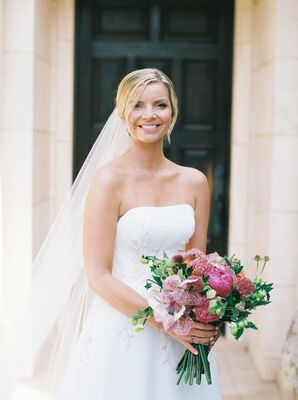 Bride in Veil and Strapless Wedding Dress Holding Jewel Tone Flower Bouquet