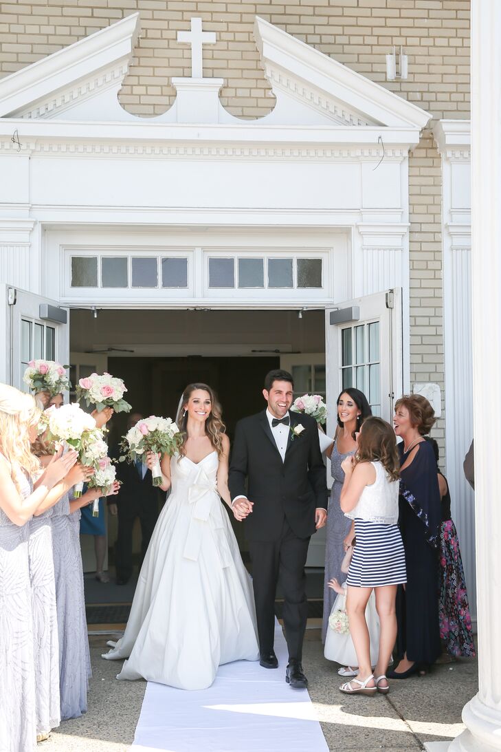 Family and friends gathered outside St. John the Baptist Church to congratulate the newlyweds before the reception.