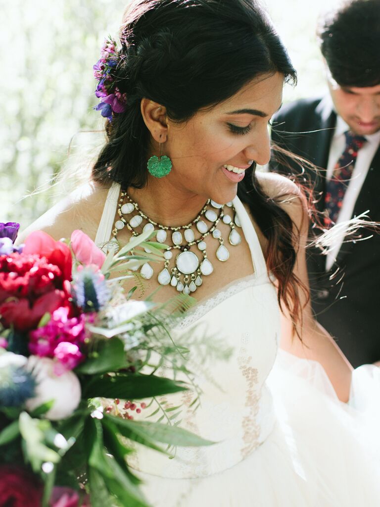 half up wedding hairstyle with braids and colorful flowers