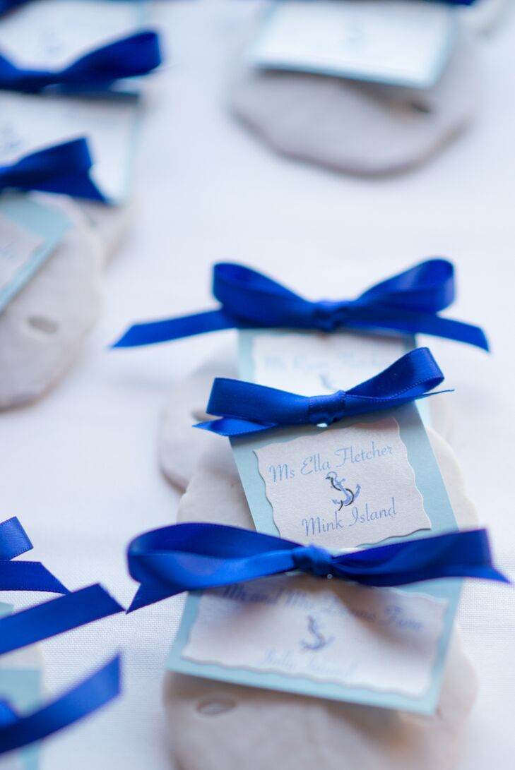 When it came to the design decisions, Katie and Steve took their wedding decor in a nautical direction. The couple and their children love to spend the summers on their boat on Lake Winnipesaukee in New Hampshire, so the theme was the perfect fit. Small details like handmade sand dollar escort cards touched on the theme and gave the decor a playful touch.