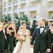Couple with Wedding Party Dressed in Chic Black Attire