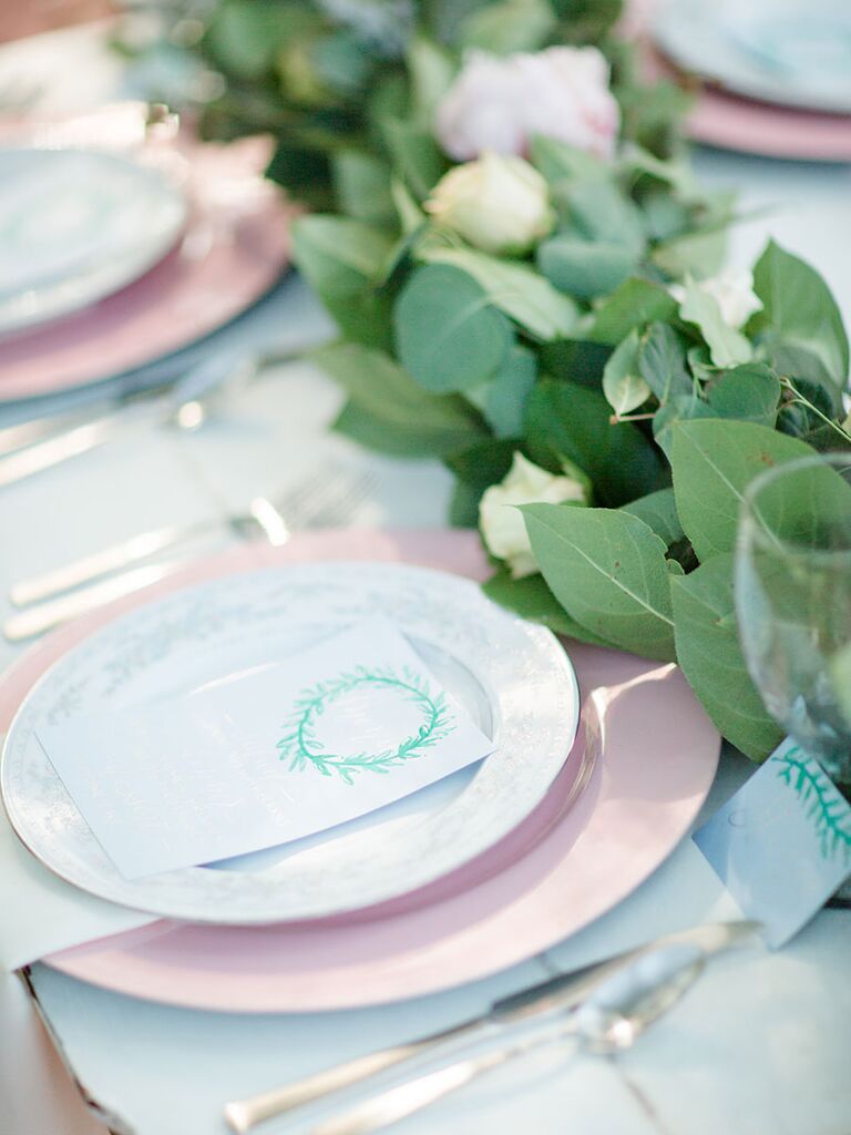 A Natural, Pastel Table Setting Accented With Greenery