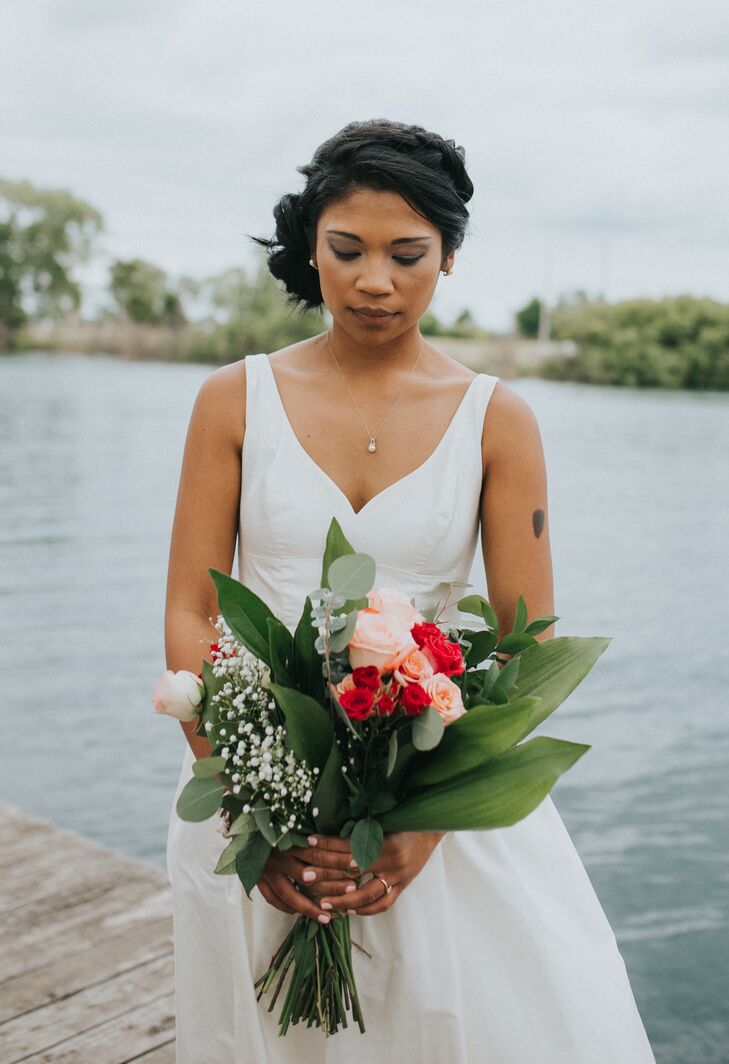 Flower arrangements consisted of pink roses, orchids, oversize leaves and baby’s breath. “Our  flowers were special because they were picked up fresh from the Eastern Market that morning and assembled into bouquets by the women in my family,” Josephine says.