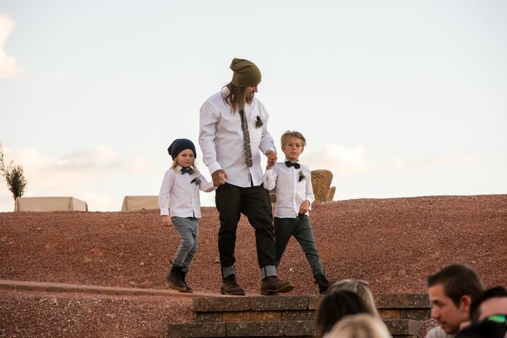 "Jesse has probably never worn a tux in his life, so I was not about to put him in something he's not comfortable in," Christa says. Instead, Jesse walked down the aisle with their sons in jeans, a white button-down shirt, a floral tie, boots and his signature beanie.