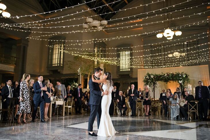 Elegant First Dance Beneath String Lights at the Harold Washington Library in Chicago, Illinois