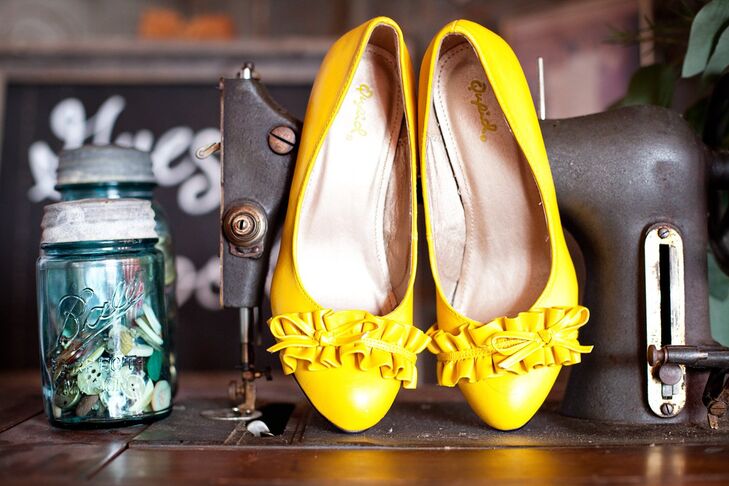 The bridesmaids wore different dresses in the same color with yellow flats.