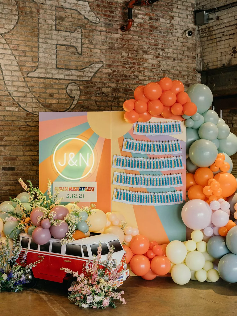 Escort Card Display With Balloons for a retro-style wedding reception