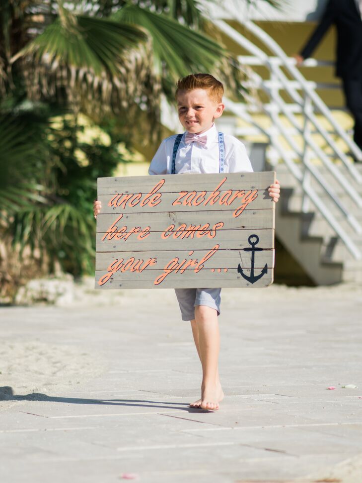"My ring bearers wore light gray shorts with nautical suspenders and a bow tie, which matched the guys' ties. We were all barefoot, to keep the laid-back feeling," Nicole says.