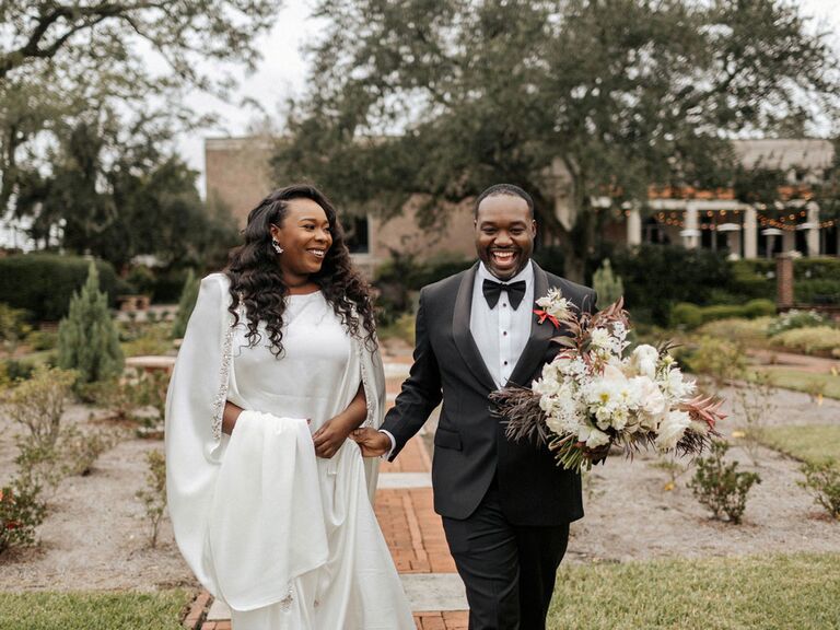 Classic bride and groom at outdoor wedding with black and white fall wedding color scheme