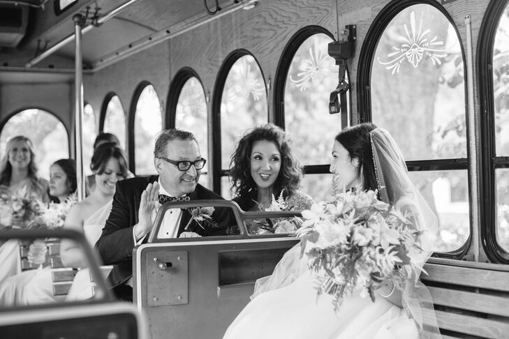 Since Nina's father hadn't seen her dress, he met her at Lowndes Grove Plantation for a first look before the church ceremony in Charleston, South Carolina. After the father-daughter look, Nina rode to the ceremony in a white trolley with her parents, her aunt, her bridesmaids and Tristan's mom.