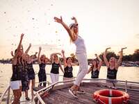 Bride and bridesmaids on a boat at bachelorette party