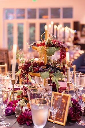 Multi-Tiered Gold Fruit Display Platter Centerpiece Surrounded By Candles, Jewel Tones