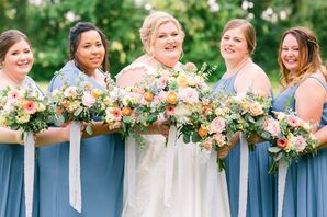 Bride Posing With Bridesmaids in Blue Dresses at County Line Orchard in Hobart, Indiana