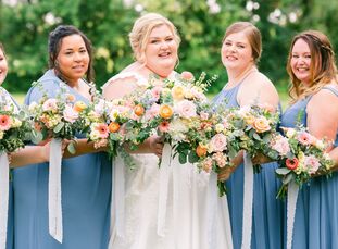 Lilly and Raymond's wedding at Country Line Orchard in Hobart, Indiana, was a cheerful explosion of flowers and colors. Soft shades of pink, orange, b