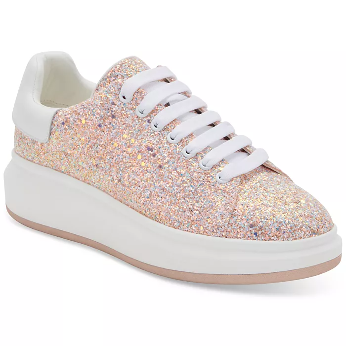 Blush sneaker adorned with glitter and features bright white laces