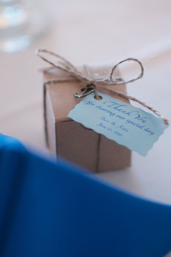 As a thank-you to their guests, Katie and Steve sent their friends and family members home with a few locally made sweet treats. The couple picked up sailboat-shape chocolates at Harbor Sweets in Salem, Massachusetts, and wrapped them in small brown boxes dressed up with miniature anchor charms.