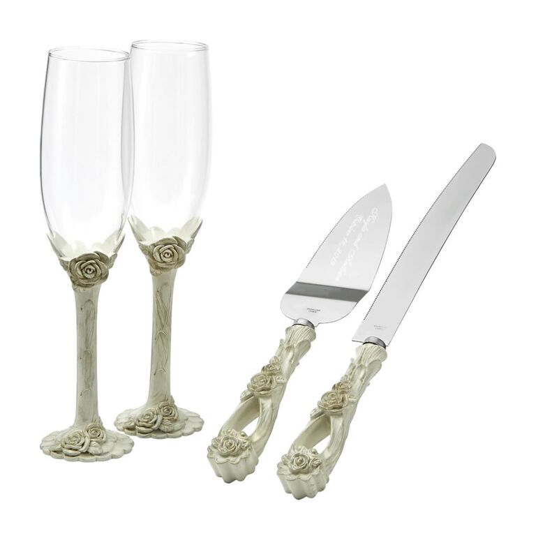 Matching rose-embellished cake cutting set and champagne flutes. 