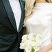 Groom and Bride Holding Simple, Elegant Bouquet of All-White Calla Lilies for Garden Wedding