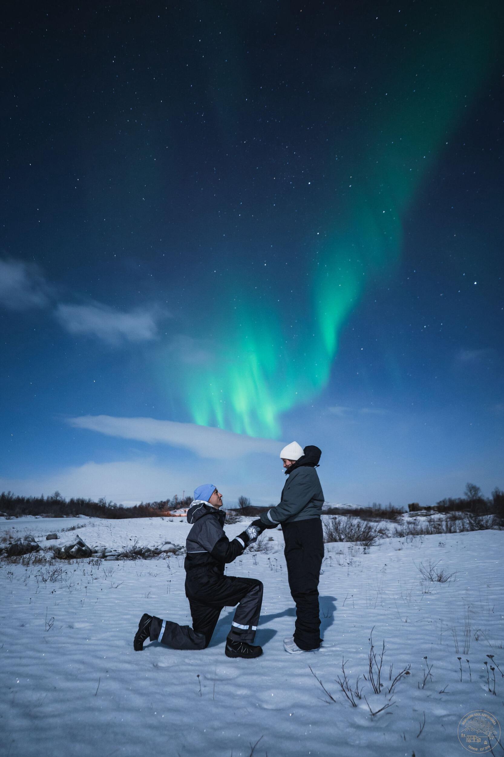 Cameron brought Lindsey on her first international trip and proposed in Tromsø, Norway under the Northern Lights