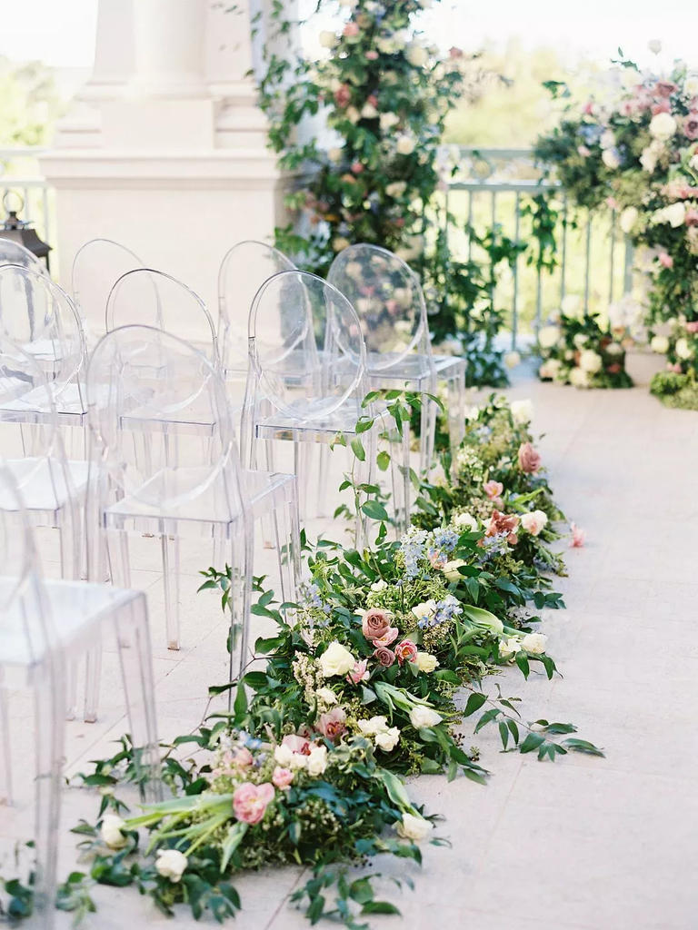 These pastel arrangements are perfect to guide guests up a dreamy wedding aisle.