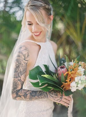 Bride Poses with Bouquet of Tropical Flowers
