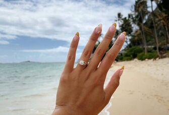 Engagement ring selfie on the beach