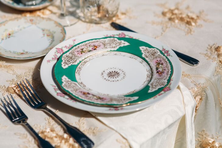 Antique green and white chinaware set at each seat contributed to the "shabby-chic tea party" atmosphere that Monique and Shade had imagined for their wedding day at Rancho San Antonio in Santa Ynez Valley, California.