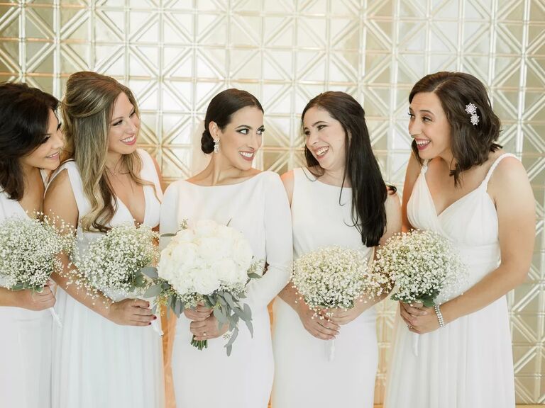 Bridesmaids in Monochromatic Dresses With All-White Baby's Breath Bouquets