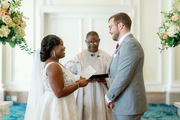 Bride Reading Written Vows to Groom in Ballroom Setting, Father Pastor Officiant