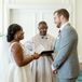 Bride in A-Line Gown With Deep-V Illusion Neckline, Groom in Olive Recessing Aisle, Thrown Flower Petals