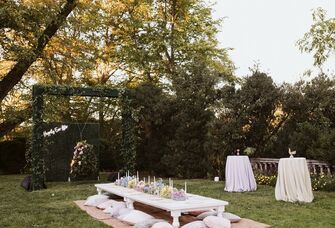 bridal shower dessert table surrounded by pink iridescent balloons