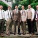 Just as the bridesmaids did, each groomsman took on his own look. The men mixed things up with brown shoes, earth tone-inspired pants and white shirts. Even their ties were different with eclectic burgundy, navy, hunter green or neutral looks. A fern boutonniere tied them all together. Mike stood out in the only full suit by Ermenegildo Zegna, an olive tie and a feather in his arrangement.