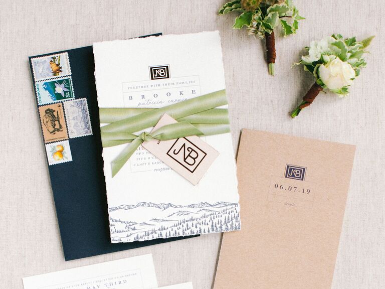 Deckled edge wedding invitation with black stamped envelope