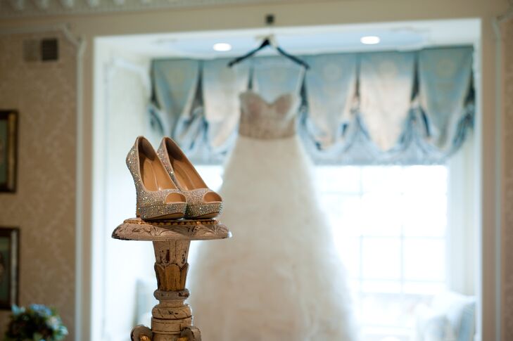 Lisa's wedding gown was a strapless, A-line ball gown with a sweetheart neckline and a chapel length train.  The top of the dress was hand beaded and full of sparkle. The skirt had a flower peddle like texture with pops of sparkle throughout. The cathedral length veil was custom made to match the dress in both color and sparkle.