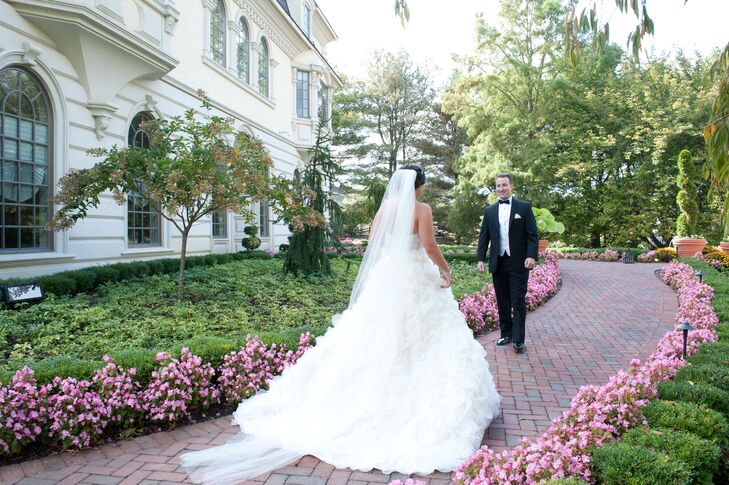 Bride and Groom Meeting on a Path in the Garden