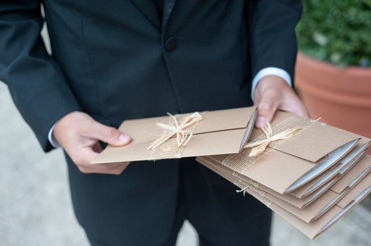 Usher Passing Out Straw Accented Programs