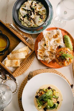 Latin Guatemalan Food Including Roasted Vegetables, Chips and Dip, Bread