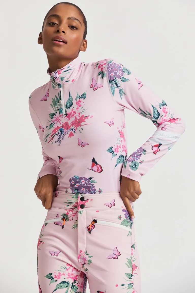 matching snow pants and quarter zip with floral and butterfly print