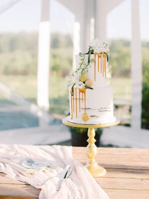 Two-Tier Wedding Cake With Caramel Drips Decorated With Macarons