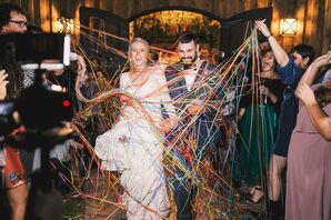 Bride and Groom Greeted by Streamers