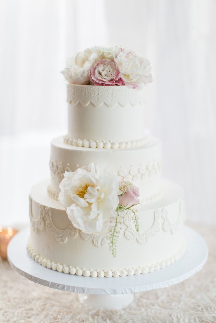 Bree and Greg's three-tier cake from Cake bakery in San Diego, California, boasted intricate, fabric-like details that spoke to the day's polished, intimate aesthetic.